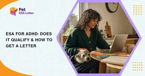 ESA for ADHD: a woman working at a kitchen table with sticky notes and a laptop, her terrier resting on her lap
